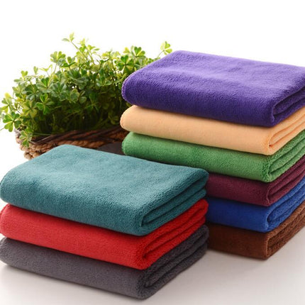 Colorful microfiber pet towels stacked neatly, showcasing soft, super absorbent material.